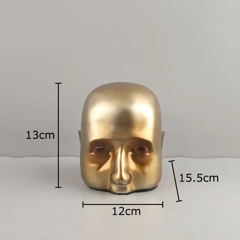 Modern golden abstract resin sculpture of a smooth bald human head as a resin sculpture ornament for office decorbites decor