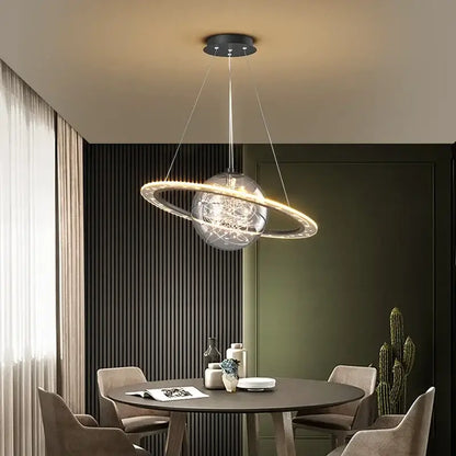 Modern golden acrylic led chandelier bedroom planet pendant light with clear glass sphere and glowing ring decorbites golden acrylic