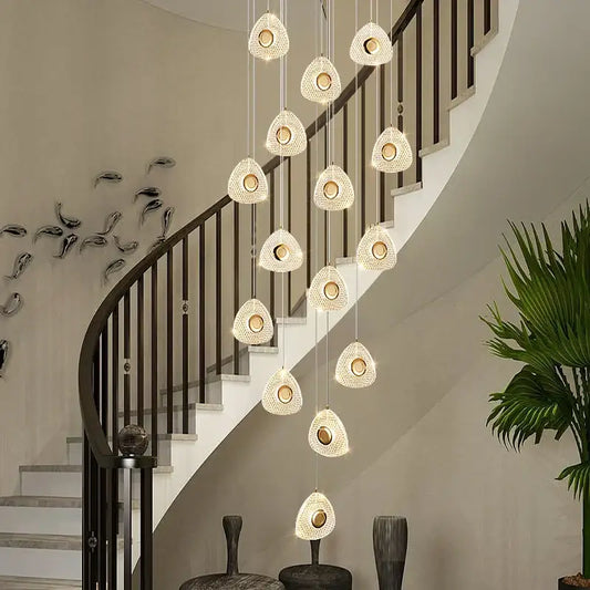 A modern golden acrylic led chandelier with cascading clear crystal teardrop lights for living room decorbites golden acrylic