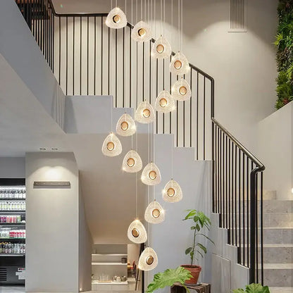A modern golden acrylic led chandelier with cascading teardrop woven glass pendants for living room decorbites golden acrylic