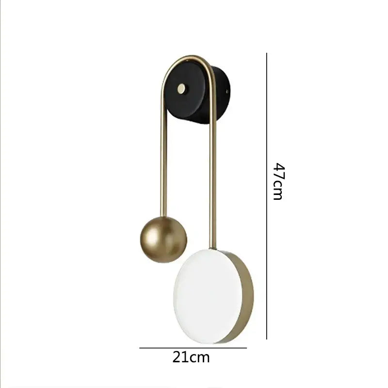 Modern golden ball led wall lamp with matte black base, brass arms, and white oval diffuser by decorbites golden ball