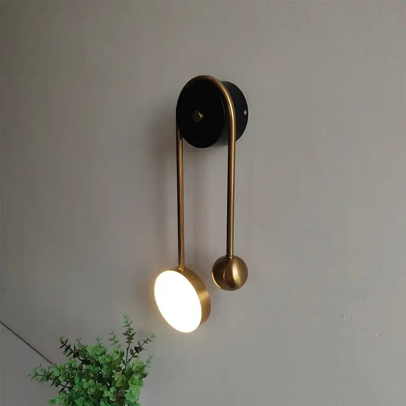 Modern brass wall lamp with sleek curved design and two spherical accents for bedroom decorbites golden ball led lighting