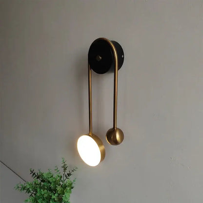Modern brass wall lamp with sleek curved design and two spherical accents for bedroom decorbites golden ball led lighting