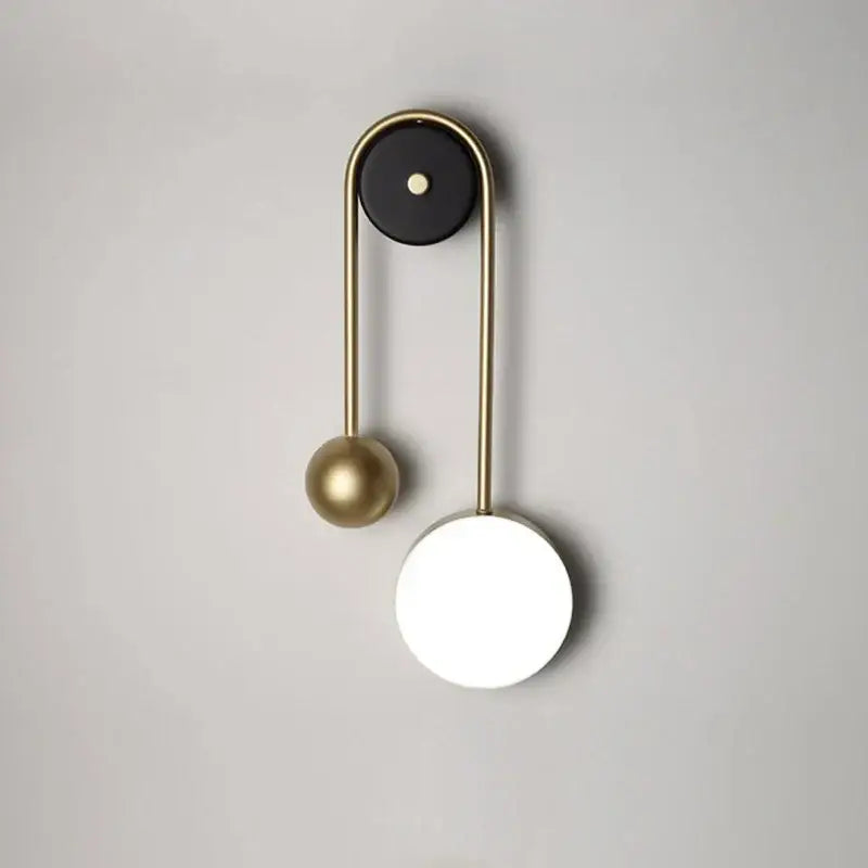 Modern golden ball led wall lamp with brass arched frame and matte black top for stylish bedroom decorbites golden ball
