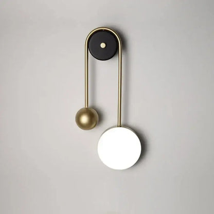 Modern golden ball led wall lamp with brass arched frame and matte black top for stylish bedroom decorbites golden ball