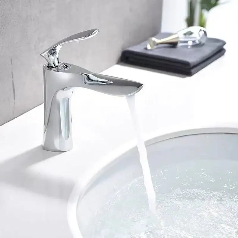 Modern chrome-finished single-handle bathroom faucet with sleek minimalist design for decorbites golden bathroom use
