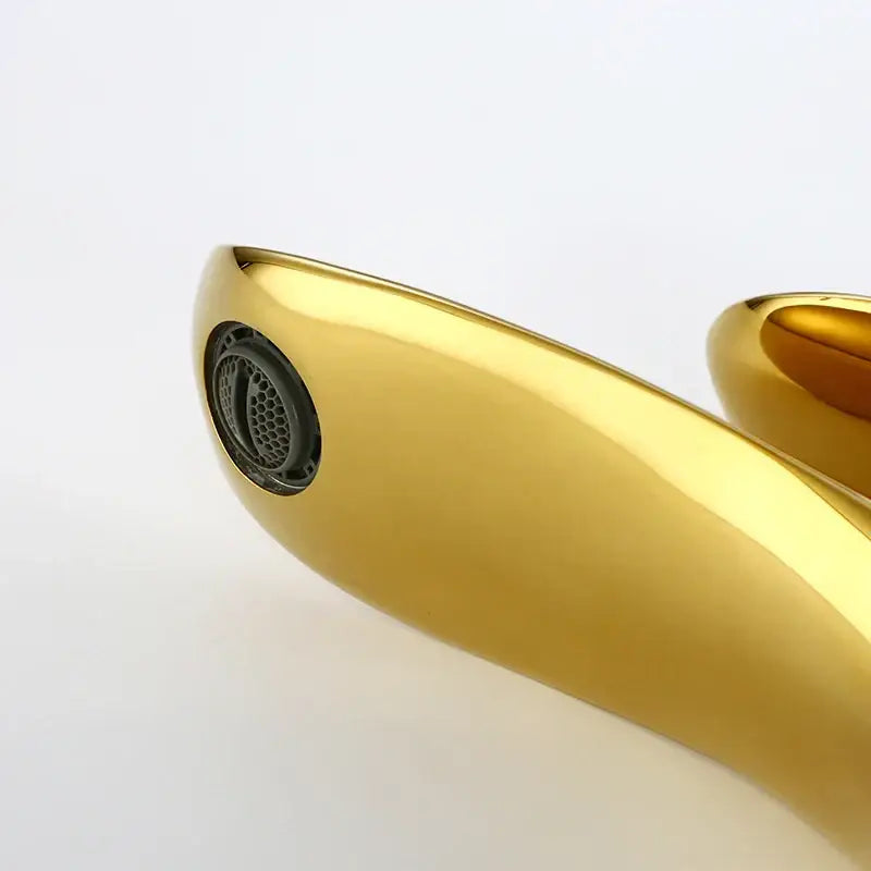 Modern decorbites golden bathroom faucet with sleek curved single handle and integrated circular mesh filter in polished metal