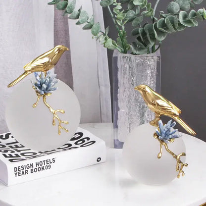 Modern golden bird brass sculpture decorbites featuring golden bird figurines on frosted glass with blue crystal branches