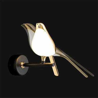 Modern golden bird led wall lamp with sleek metallic finish and glowing white diffuser for bedroom decorbites golden bird sconce
