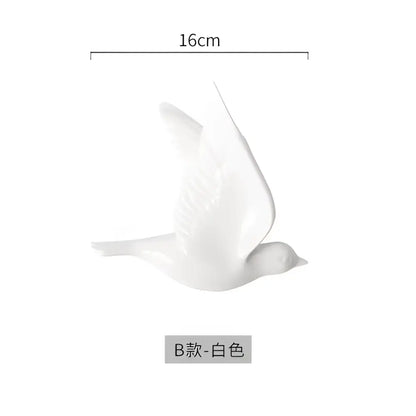 White ceramic bird figurine 16cm length as part of modern golden bird wall hanging for living room decor