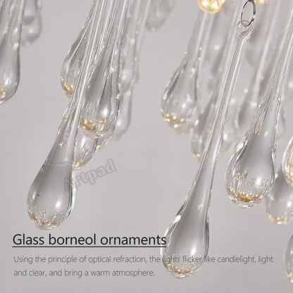 Clear glass teardrop-shaped ornaments with gold-toned base accents for decorbites golden branch led ceiling chandelier