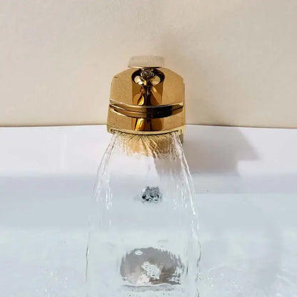 Modern golden brass waterfall vessel sink faucet with polished gold-toned brass waterfall and angular design decorbites golden brass