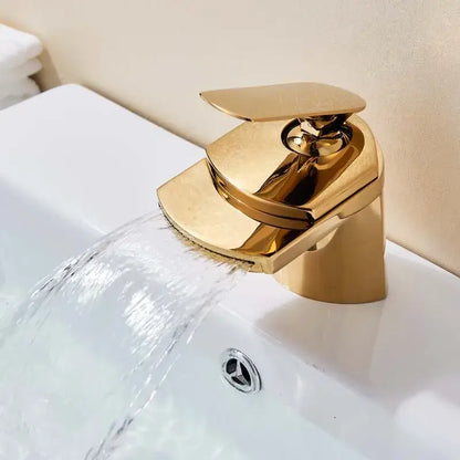 Modern golden brass waterfall vessel sink faucet with sleek angular design and polished decorbites golden brass finish