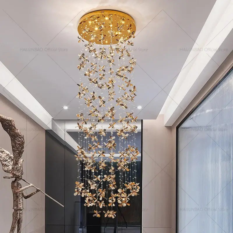 Modern golden butterfly crystal staircase chandelier lighting fixture with crystal accents hanging from circular ceiling decorbites crystal staircase