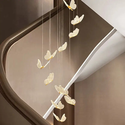 A delicate cream-colored decorbites golden butterfly led chandelier with gold-toned accents for living room decor