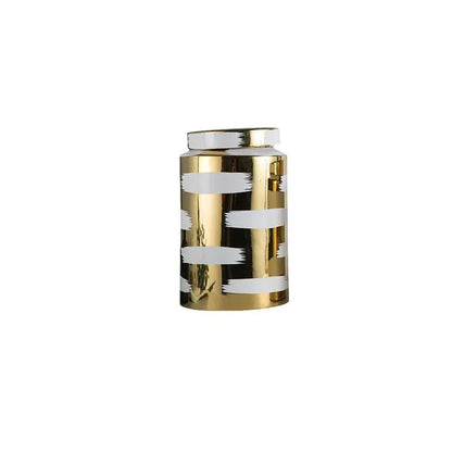 A decorbites golden ceramic cylindrical jar with glossy finish and white brushstroke stripes for living room storage
