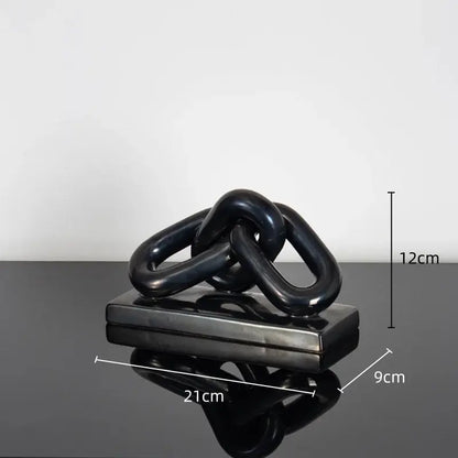 Black glossy ceramic chain sculpture on rectangular base as modern golden chain home decoration figurine for living room