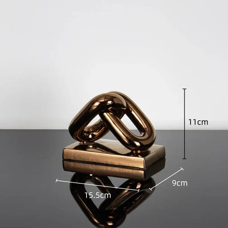 Modern golden chain home decoration figurine featuring a bronze metallic abstract sculpture of interlocking chain links