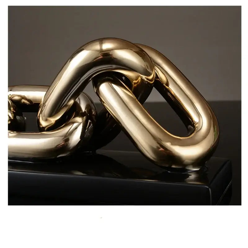 Shiny gold-toned metallic chain home decoration figurine with smooth reflective surfaces for living room decor