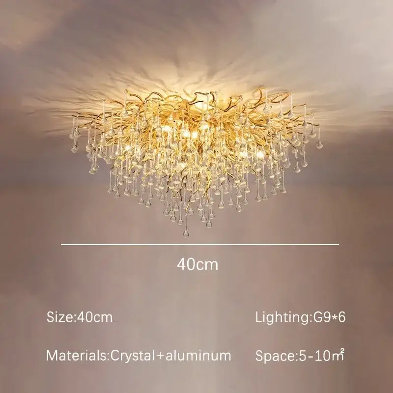 Modern decorbites golden chandelier with branching aluminum arms and clear crystal dangles for dining room decor