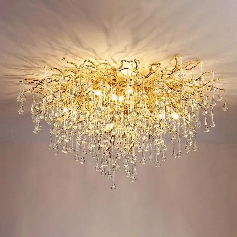 Modern golden chandelier branch crystal lamp with dangling droplets for dining room by decorbites golden chandelier