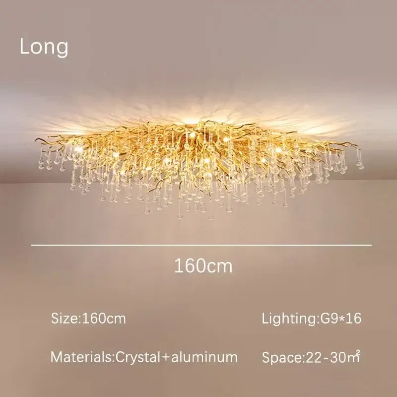 Modern decorbites golden chandelier featuring branch-style design with dangling crystal droplets for dining room decor