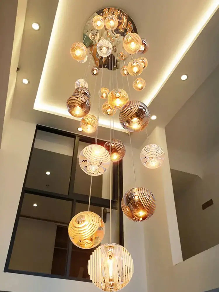 Modern golden crystal glass spiral ceiling chandelier with cascading spherical orbs featuring intricate patterns for living room decorbites crystal glass