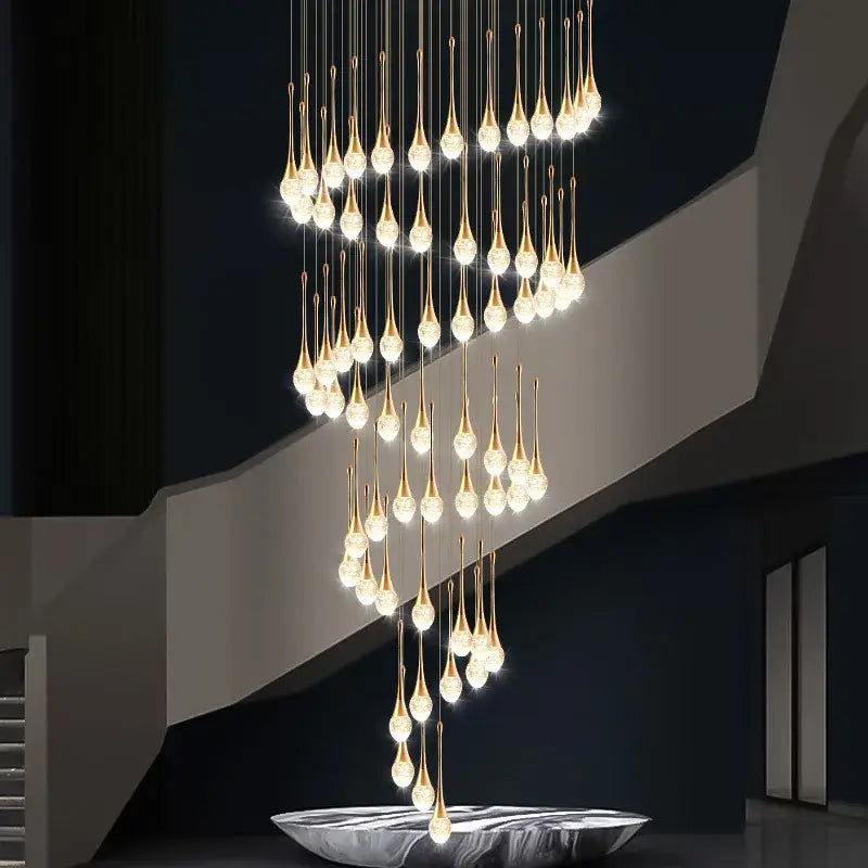 Modern golden crystal led staircase chandelier with teardrop pendant design for lobby decorbites crystal led lighting