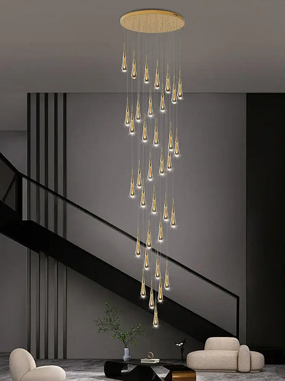 A modern decorbites crystal pendant chandelier with golden teardrop lights and a circular wooden ceiling mount