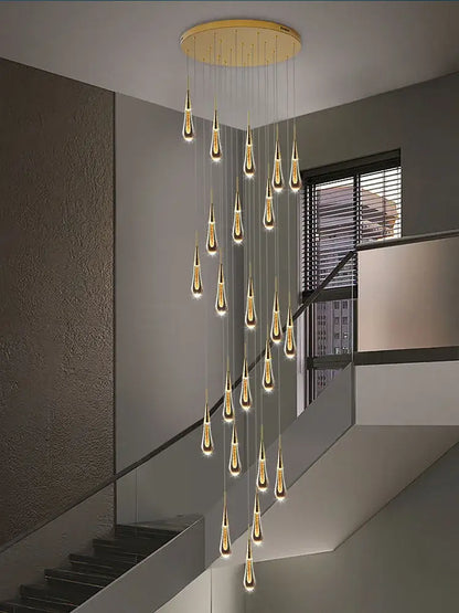 Modern golden crystal pendant chandelier with teardrop decorbites crystal pendant lights in an elegant living room decor