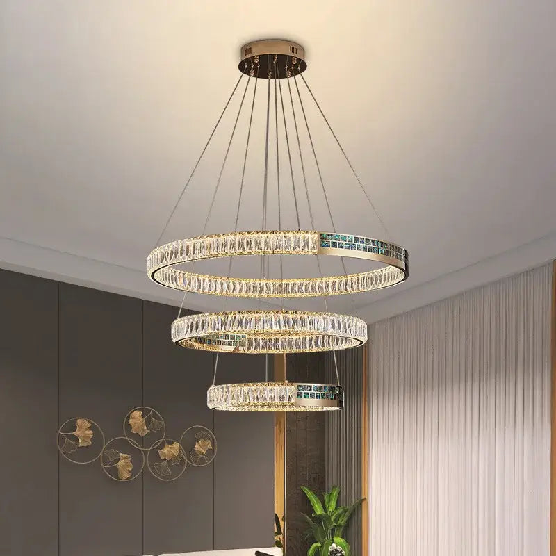 Modern golden crystal ring ceiling chandelier with gold metal frames teal mosaic tiles and cascading clear crystals decorbites crystal ring