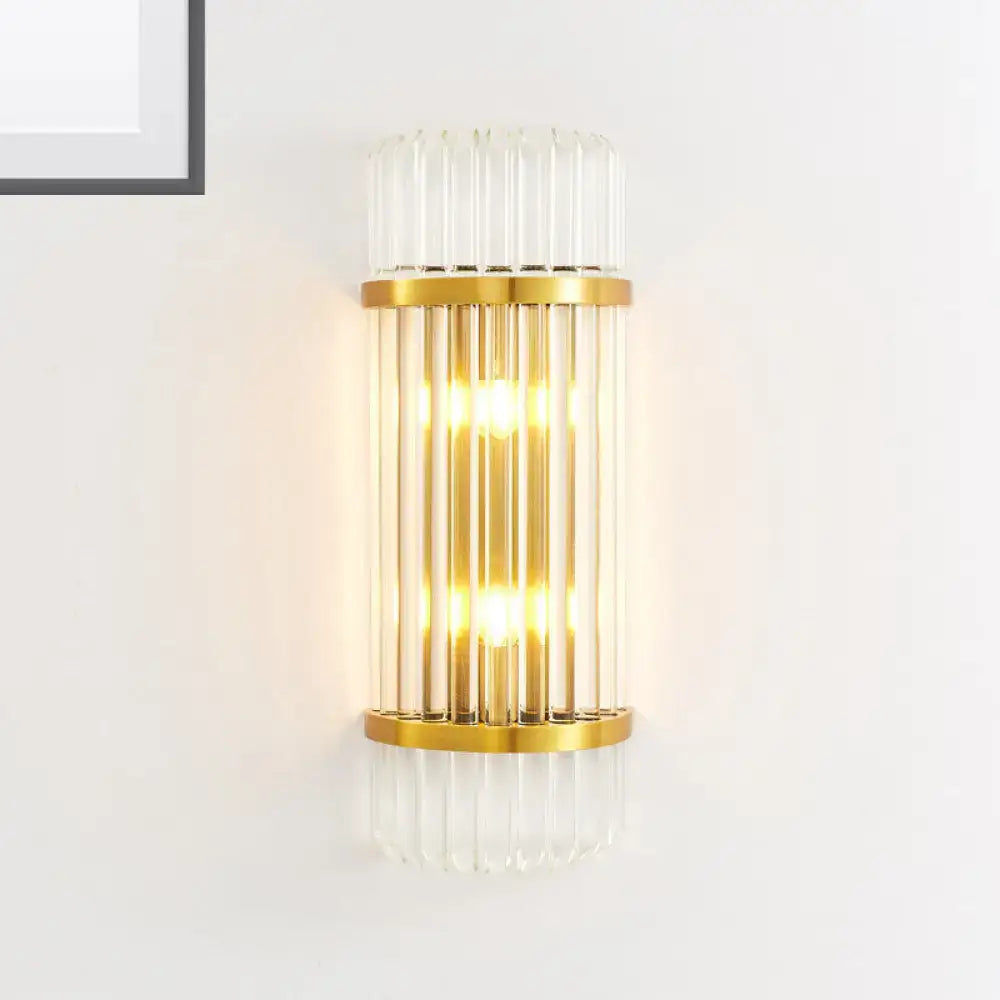 Modern golden crystal shade wall sconce with vertical glass tubes and warm glowing light for bedroom use wall lamp