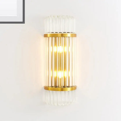 Modern golden crystal shade wall sconce with vertical glass tubes and warm glowing light for bedroom use wall lamp