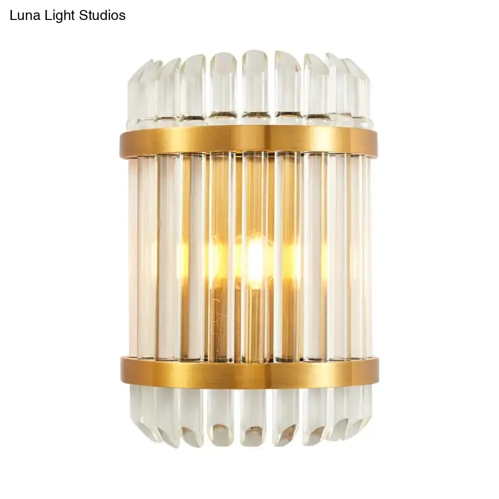 Modern golden crystal shade wall sconce featuring gold-toned metal, clear glass rods, and fluted crystal accents for bedroom lighting