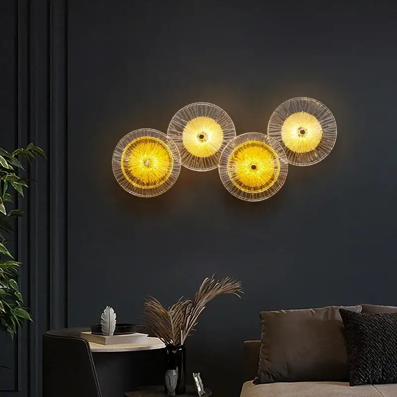 Set of four modern golden crystal wall lamps with translucent yellow glass shades and delicate wireframe decorbites crystal wall design
