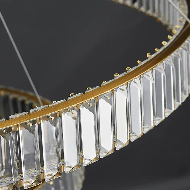 A modern golden double ring decorbites crystal led ceiling chandelier with clear rectangular crystal prisms for dining room