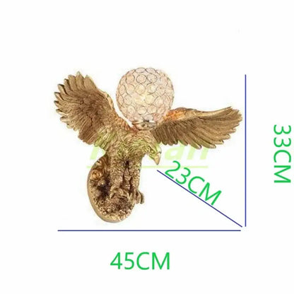 Modern golden eagle crystal led wall lamp with intricate feathers and textured crystal globe for bedroom living room