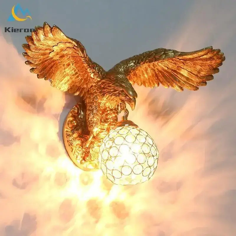 Modern golden eagle crystal led wall lamp with detailed feathered wings and patterned glass globe for bedroom living room