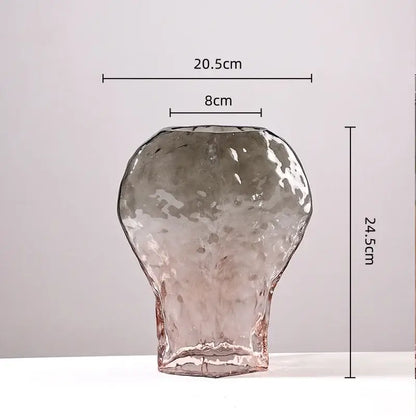 A translucent textured glass vase with hammered finish and subtle pink hue in decorbites golden geometric glass set