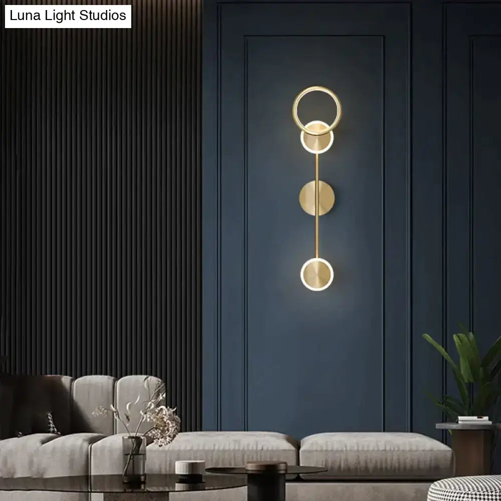 Modern golden geometric led wall lamp with three stacked circular rings for living room wall lamp lighting