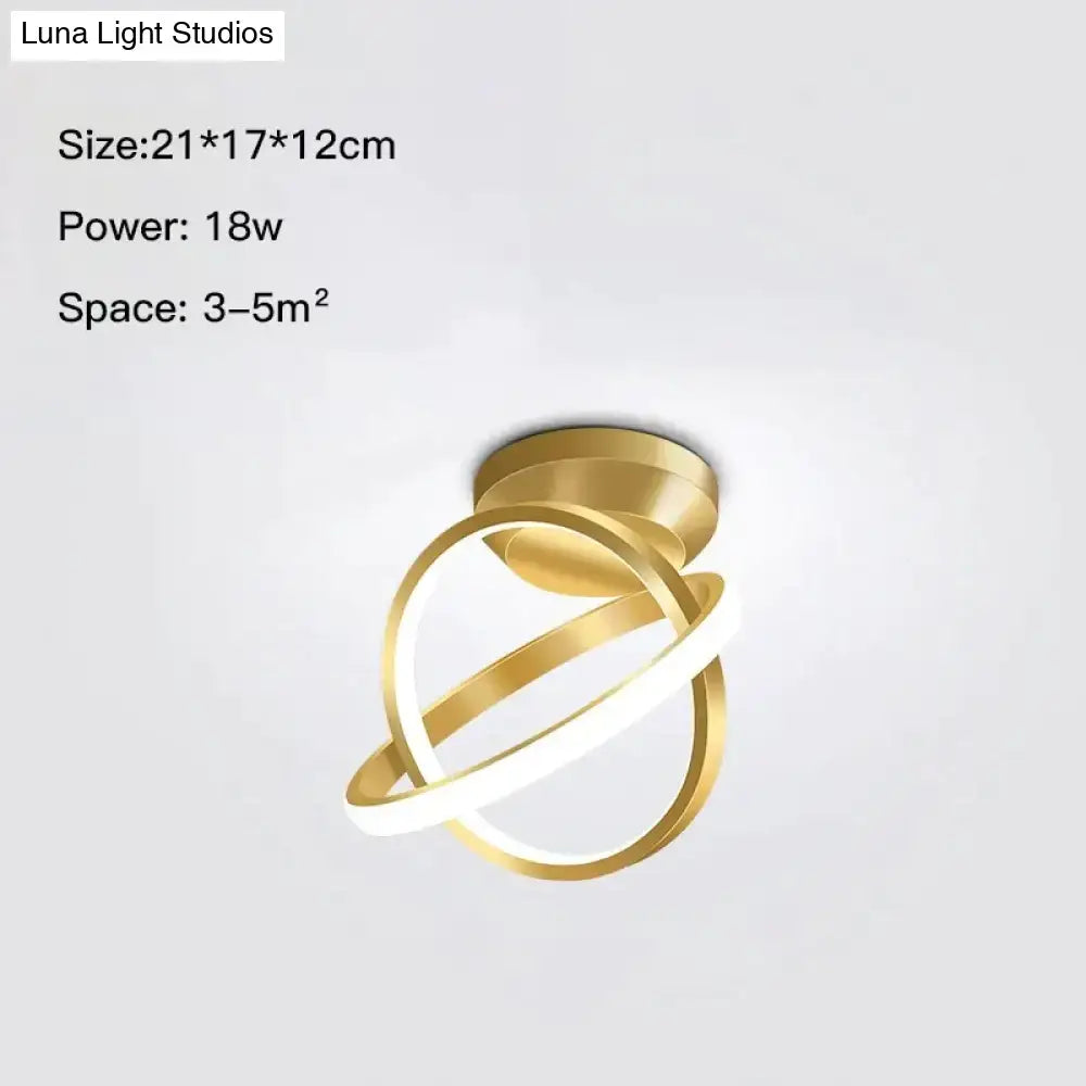 Modern golden geometric led wall lamp with intertwined circular rings in gold tone for living room use