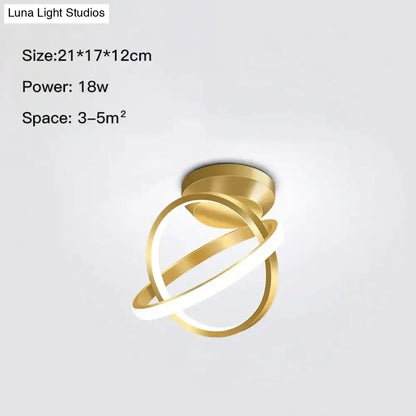 Modern golden geometric led wall lamp with intertwined circular rings in gold tone for living room use