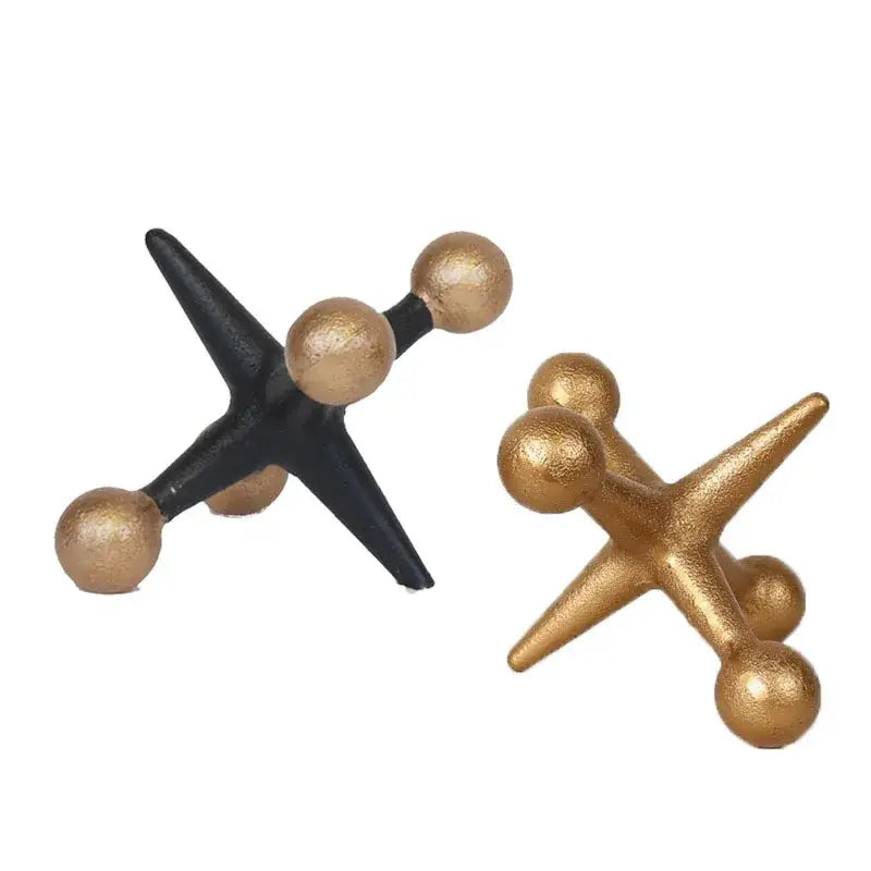 Modern decorbites golden geometric resin molecular model featuring black and gold metallic star-shaped game pieces with rounded ends