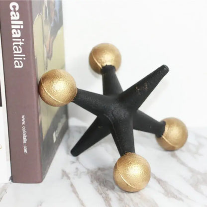 Black and gold star-shaped bookend with matte finish made of golden geometric resin molecular model for modern decorbites decor