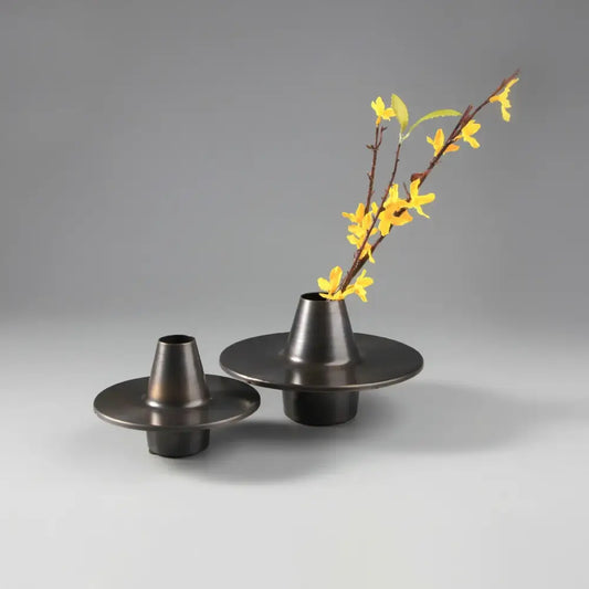 Modern golden geometry metal decorbites vases with dark matte finish conical openings and yellow blossoms