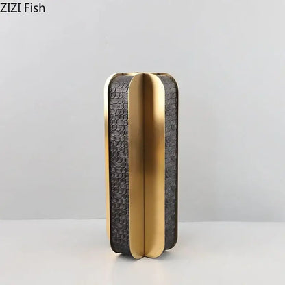 Black textured clutch with gold trim and sleek modern design complementing decorbites golden geometry vase decor