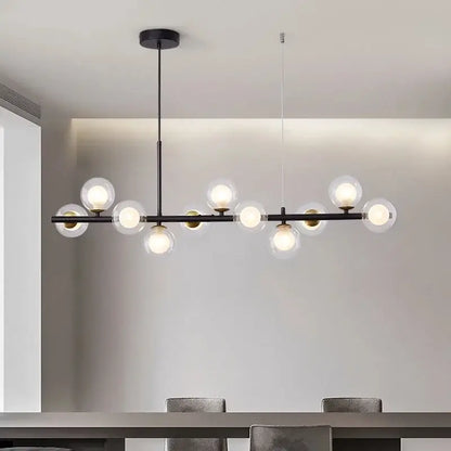 Modern black metal glass ball chandelier with clear globe bulbs and golden glass ball accents for dining room decorbites