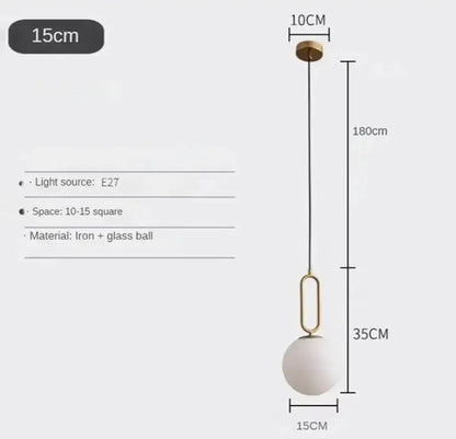 Modern golden glass ball pendant light with matte white glass sphere, brass ceiling mount, and iron chain decorbites golden glass