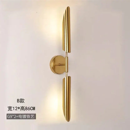 Modern golden inclined tube wall lamp with gold-finished vertical bars and circular mounting plate for luxury decorbites wall lamp