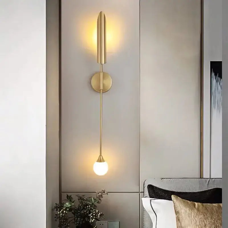 Modern golden inclined tube wall lamp with gold-toned cylindrical shade and frosted glass bulb for living room decorbites golden inclined